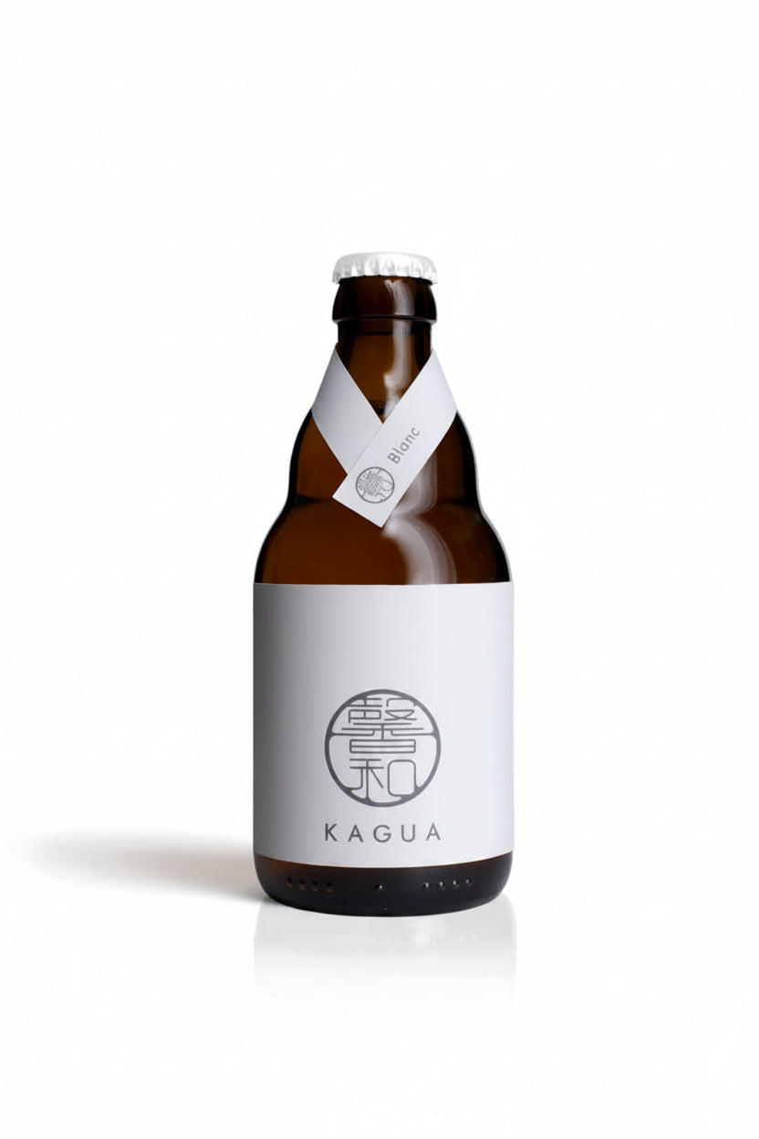 An amber glass bottle with a white label and white neck ribbon, featuring the brand name KAGUA and a circular Chinese-style emblem, on a white background.