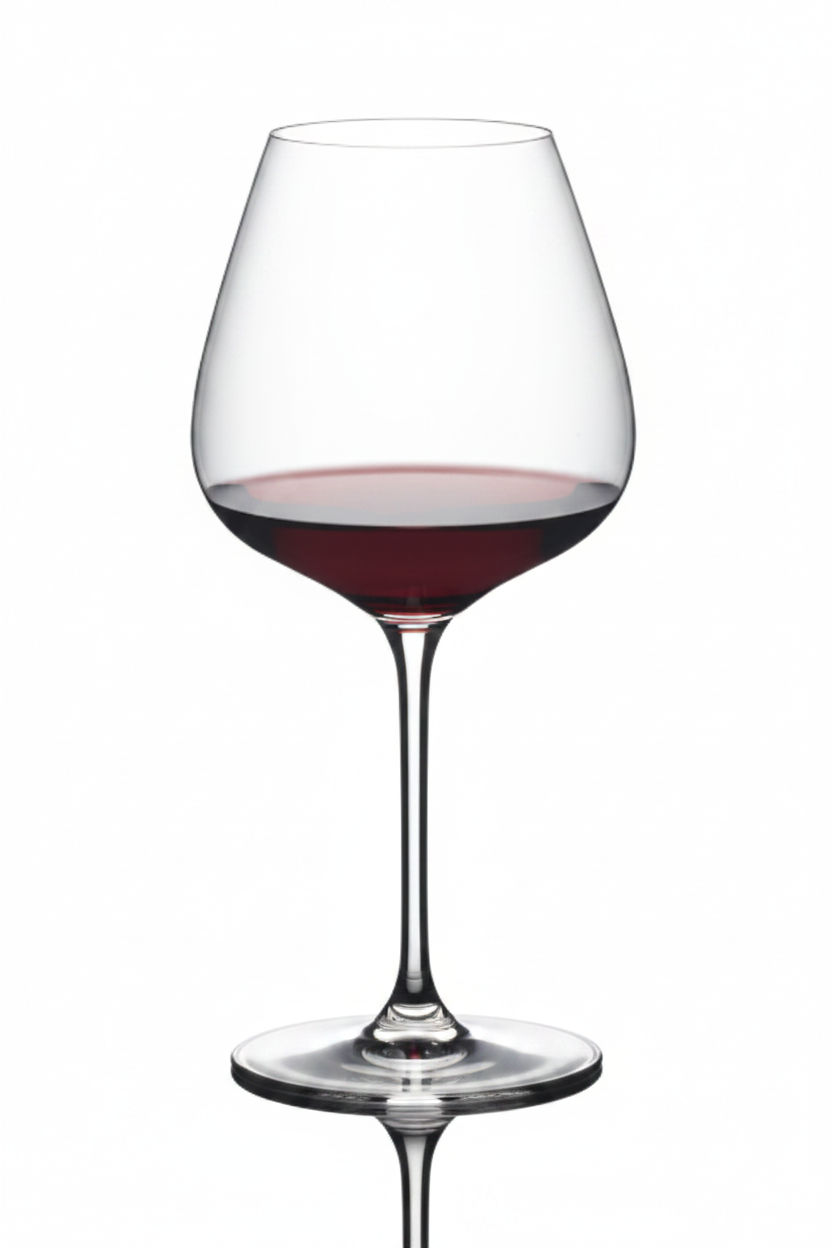 Wine glass filled with red wine on a white background