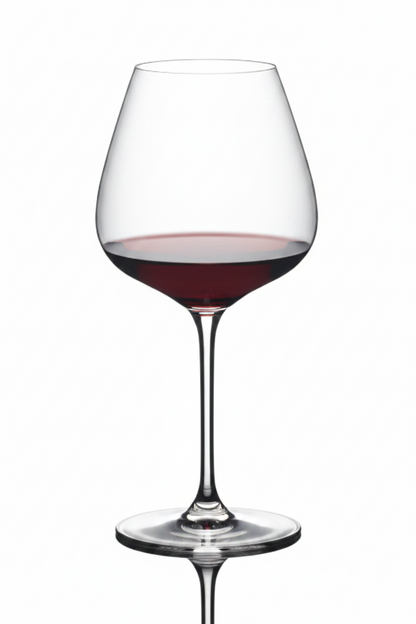 Wine glass filled with red wine on a white background