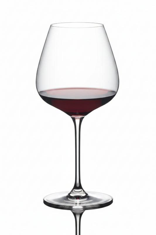 Wine glass filled with red wine on a white background