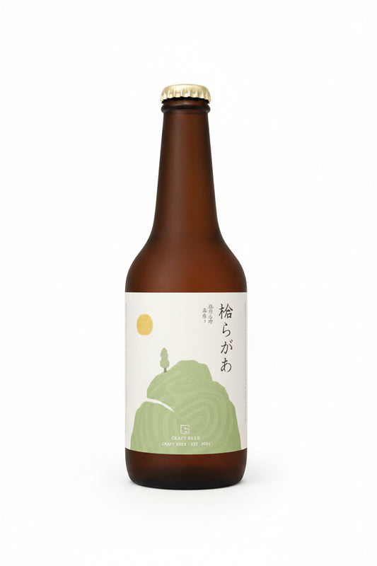 A brown glass bottle of sake with a cream-colored label featuring a green illustration of a frog and Japanese text, topped with a gold cap, set against a plain white background.