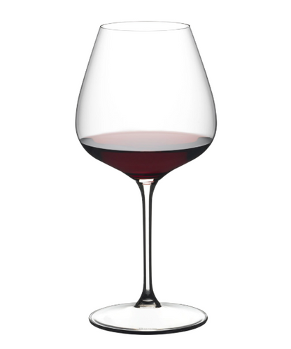 Wine glass filled with red wine on a white background